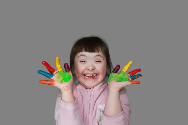 Cute Little Girl with Down Syndrome with Painted Hands (1)
